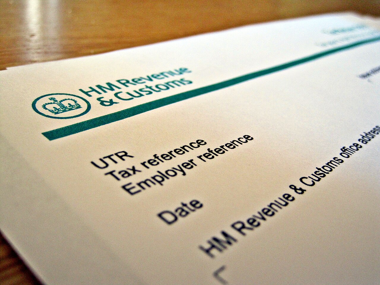 Part of an HM Revenue and Customs tax form showing the HMRC logo and fields for UTR, tax reference, employer reference and date