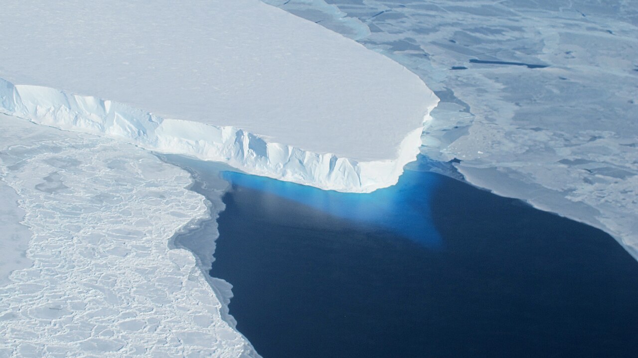 Edge of Thwaites Glacier in West Antarctica, an ice cliff above dark open water