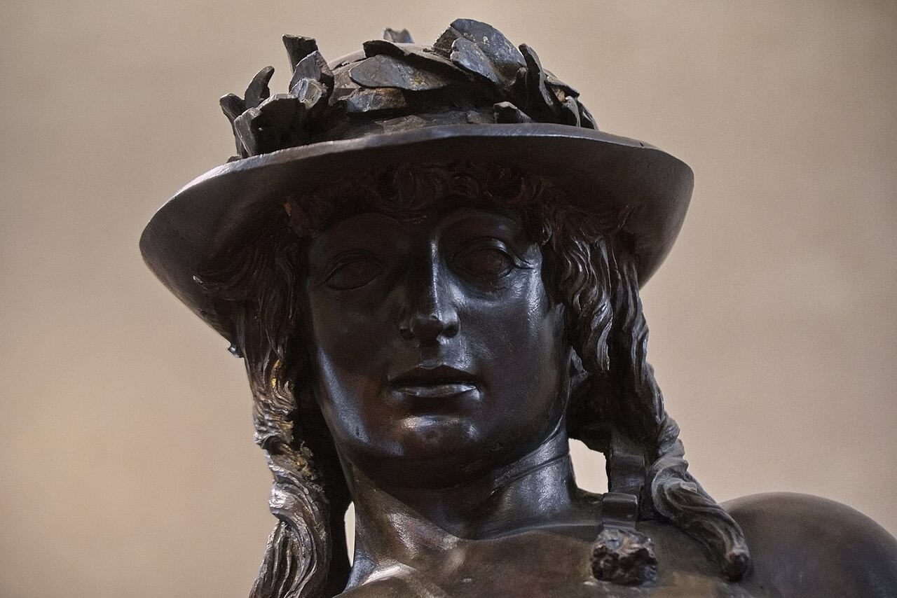 Detail of an Italian Renaissance bronze sculpture, Donatello's David, at the Bargello Museum in Florence.