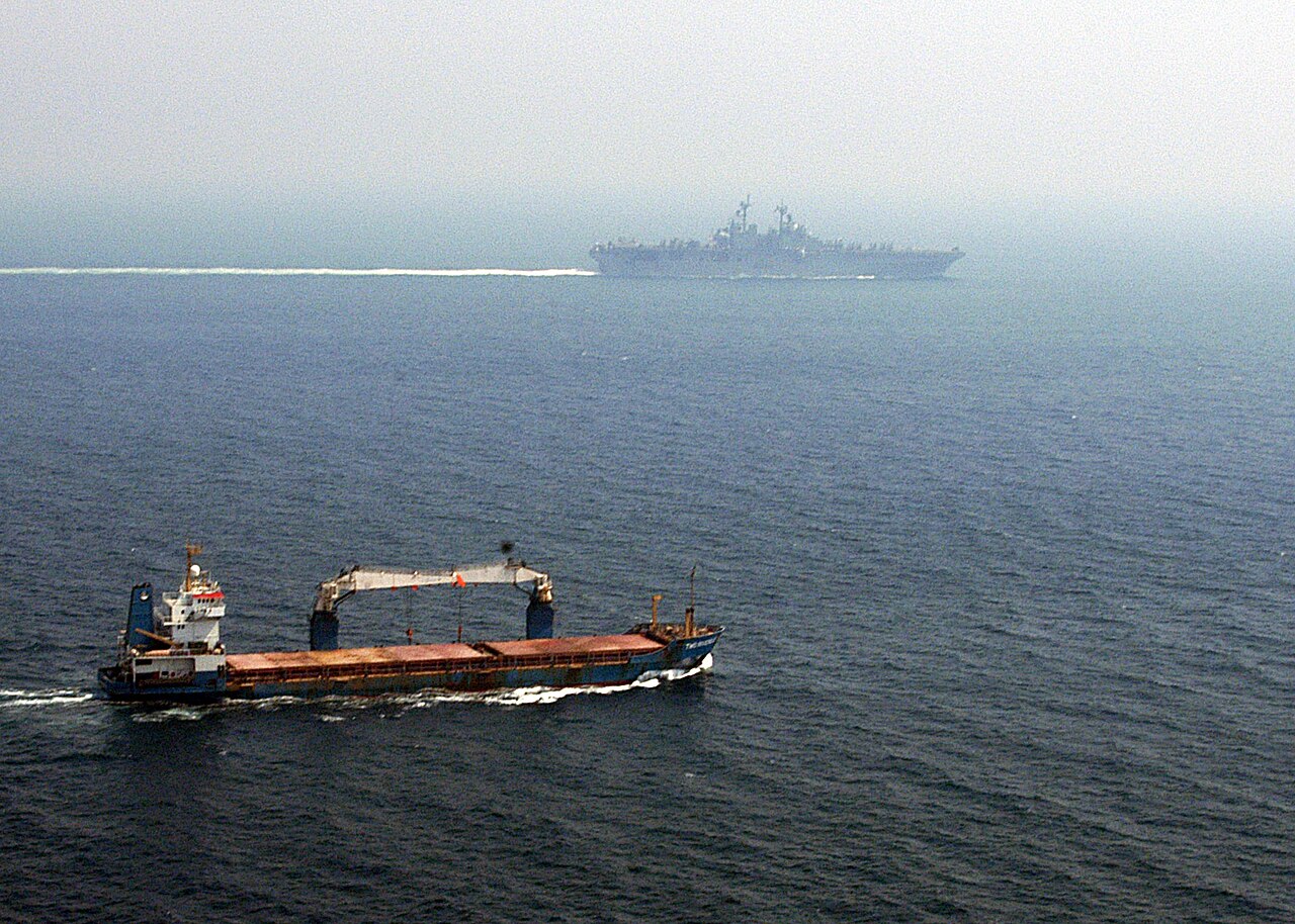A merchant ship transits the Strait of Hormuz, the narrow waterway at the centre of the dispute between Iran and the United States