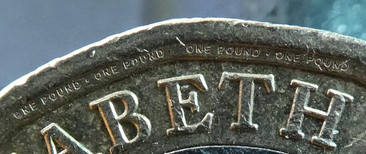 A close-up of a UK one pound coin