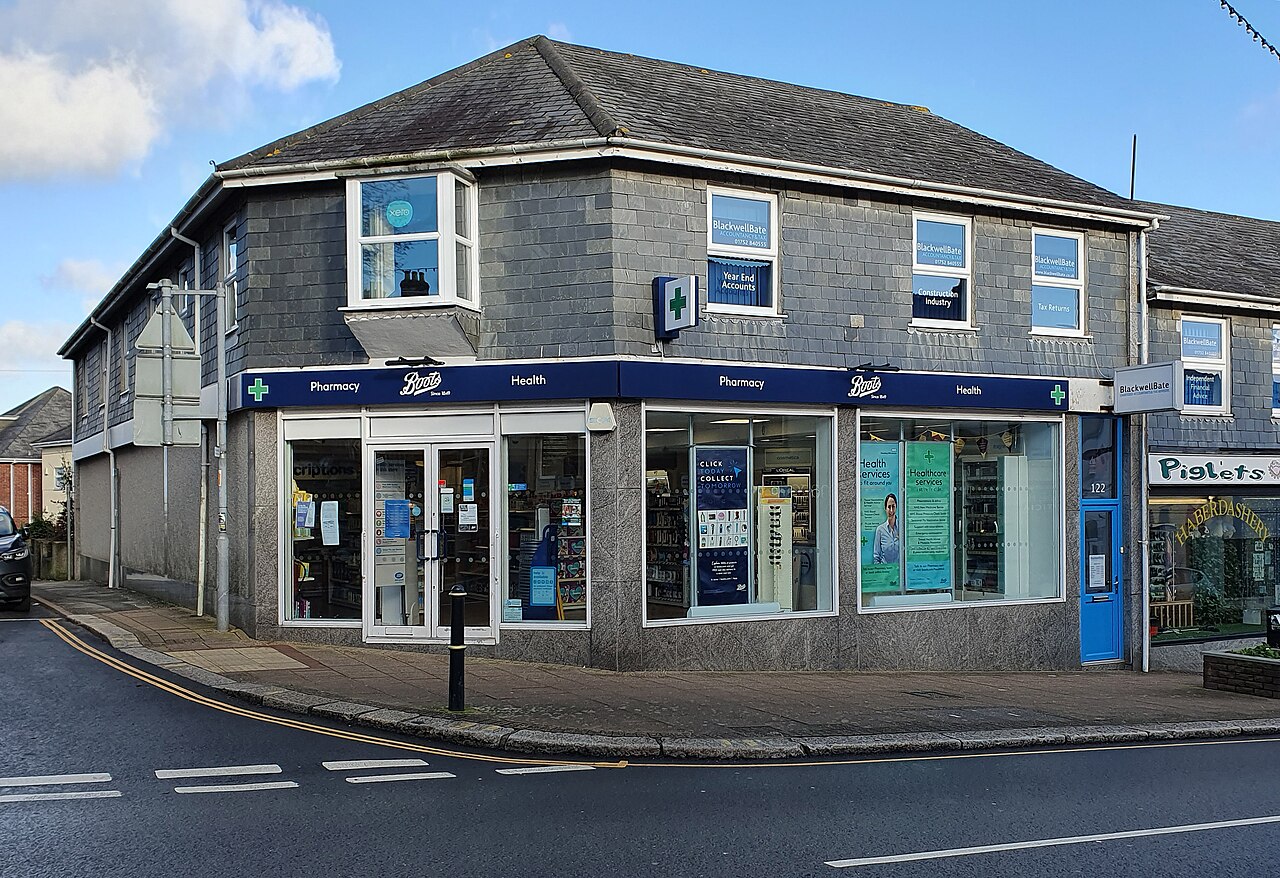 A Boots pharmacy on a street corner in Saltash, Cornwall