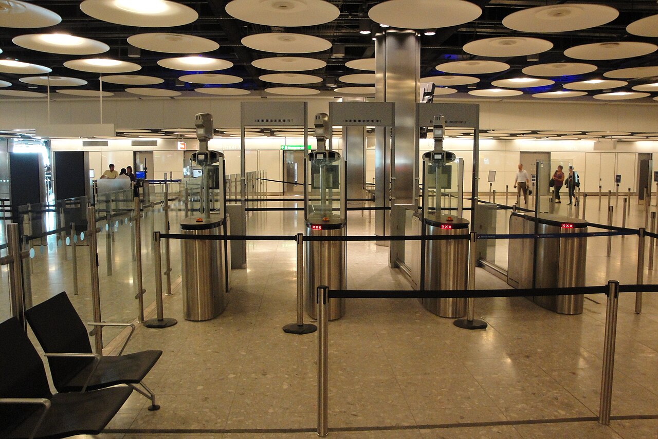 Empty ePassport gates and queue barriers in the arrivals hall at Heathrow Terminal 5