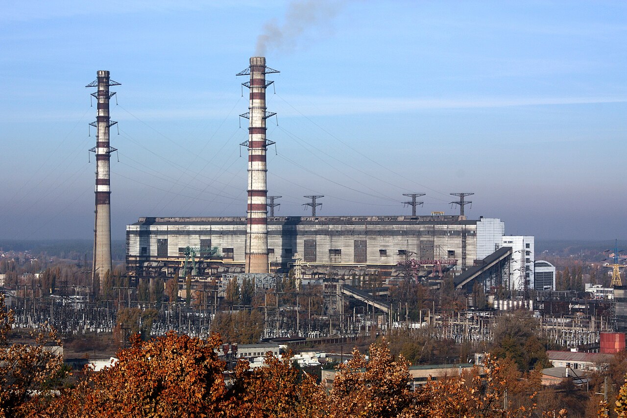 Archive photograph from 2015 of the Trypilska thermal power plant in the Kyiv region of Ukraine, with two tall chimneys and an electrical substation