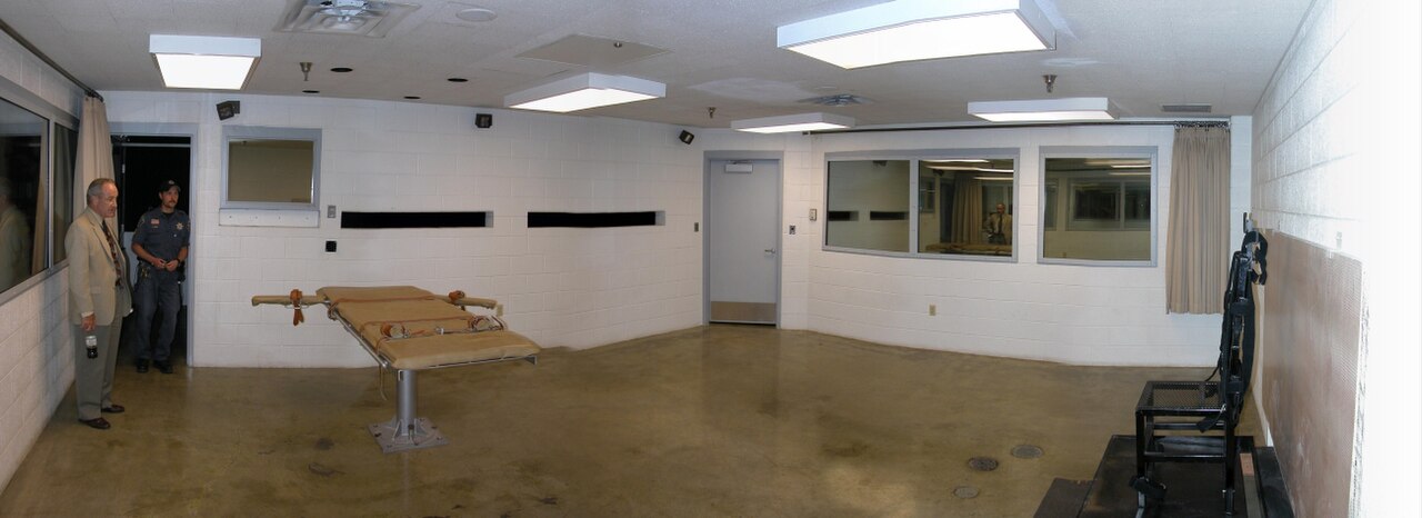 A lethal injection gurney and witness windows inside a US execution chamber