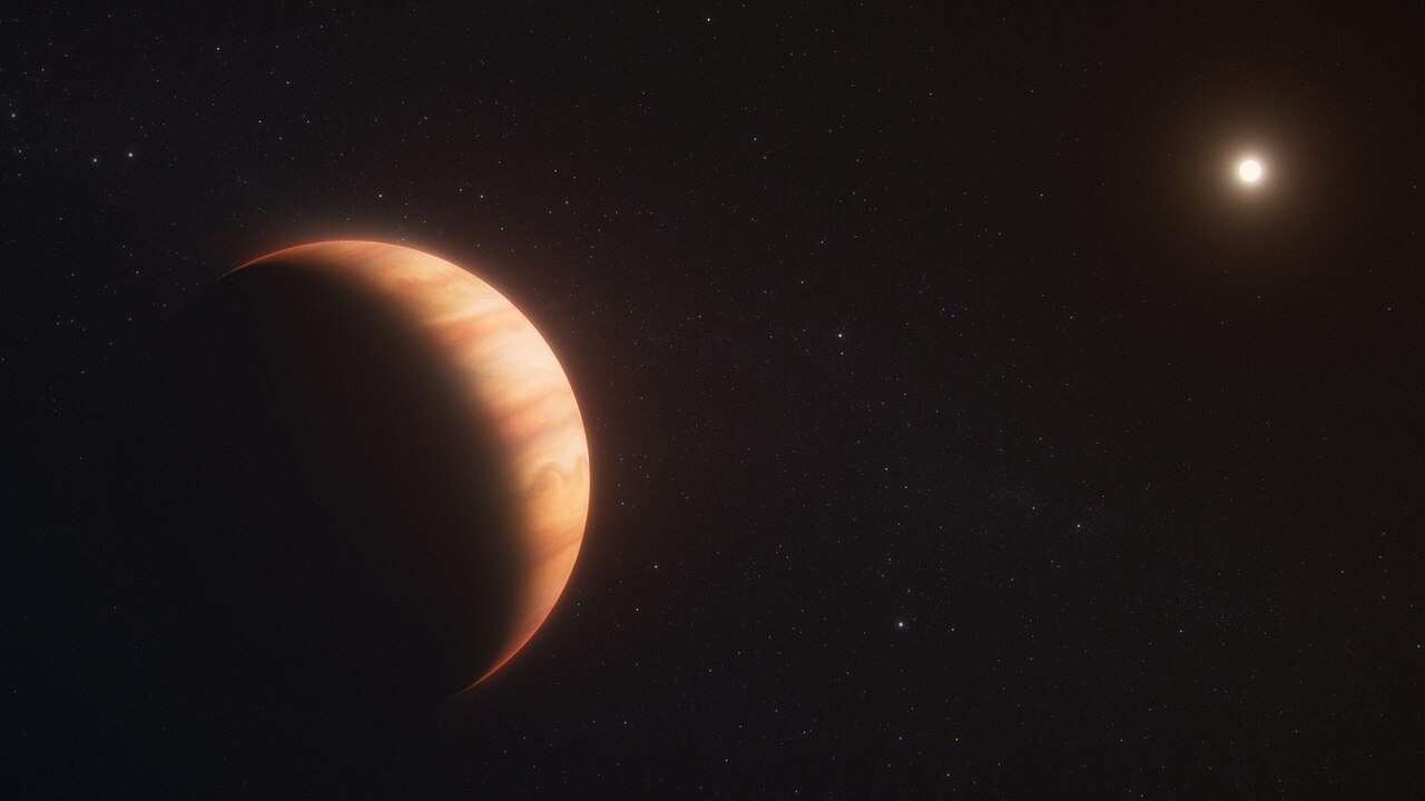 Artist’s concept of an orange, banded gas giant lit like a crescent by a distant star; the picture shows a different white dwarf planet, WD 1856 b